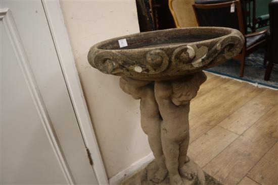 An early 20th century figural stone bird bath H.80cm